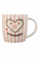 eine creme-rosa gestreifte Henkeltasse aus Porzellan mit großem, blumig verziertem Herzmotiv und dem dunkelbraunen Schriftzug Zuckersüss