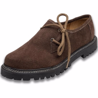 Side view of handcrafted dark brown haferl shoes featuring a block heel and rubber sole. The elegant design showcases soft leather on the interior, highlighting the durability and artisanal quality of these handmade shoes.