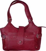 German Wear Women’s Leather Handbag in red, crafted from genuine cowhide leather. Tote bag with removable strap, zipper & magnetic closure, front zip pocket, internal compartments for phone & valuables, perfect for everyday use or special occasions.