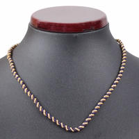 Vorderansicht mit schwarzer Statue German Wear Bayerischer Traditioneller Kordelkette aus gedrehter blau goldener Metallkordel perfekt für traditionelle Anhänger und Trachtenschmuck jetzt kaufen