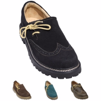 A pair of traditional black haferl shoes featuring a sturdy rubber sole and block heel. Crafted from durable leather, these handmade Bavarian shoes showcase a classic design with a short shaft, perfect for both style and comfort.