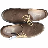 Bavarian traditional leather shoes with a durable rubber sole and 100% calfskin. Featuring a block heel, round toe cap, and short shaft, these shoes are perfect for traditional costumes. The inner lining includes German wear text indicating