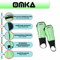 OMKA green shin guards close feature shot showing ergonomic fit, EVA cushioning, and high-quality Velcro fastening system.