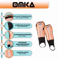 Die neonorangefarbenen Schienbeinschoner von OMKA zeichnen sich durch ihre leichte Konstruktion, ergonomische Passform und Knöchelschutz aus.