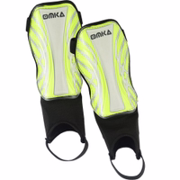 Single OMKA shin guard in green, highlighting lightweight structure, breathable material, and reinforced ankle protection.
