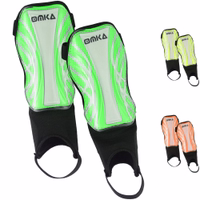 Front view of OMKA green soccer shin guards showing lightweight breathable design with ankle protection and Velcro fastening for a secure fit.