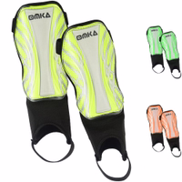 Neon yellow OMKA shin pads front view, durable EVA and polypropylene blend, pre-shaped foam interior for comfort during soccer matches.