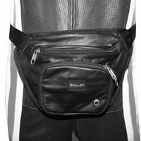 Durable leather motorcycle hip bag and leg bag in black with multiple compartments, card slots, and secure closure. Adjustable biker waist bag designed for travel, riding gear, and everyday biker style.