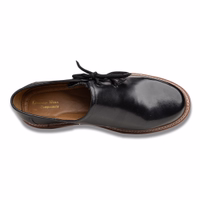 Handcrafted Bavarian traditional shoes in black, featuring a short shaft and made from 100% smooth cowhide leather. These side-laced shoes showcase a lace fastening and are crafted from real leather for a classic look.