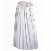 White long dirndl apron with a checkered pattern, an elastic waistband, and a bow on the side, shown against a white background.