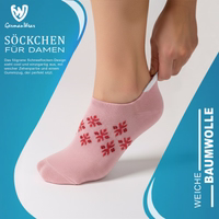 Women’s ankle socks with a snowflake design, lying flat