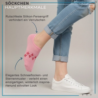 Ankle sock with visible snowflake and star pattern, lying flat