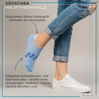 Ankle sock with visible snowflake and star pattern, lying flat