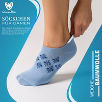 Women’s ankle socks with a snowflake design, lying flat