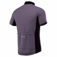 Rear views of a gray and black cycling jersey by German wear, featuring rear pockets for storage and reflective stripes on the back for improved visibility.