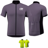 Short-sleeve gray and black cycling jersey by German Wear, featuring a front zipper, reflective stripes on the back, ergonomic cut, and rear pockets for storage.