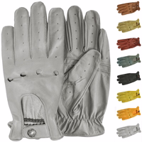 Front & rear view of luxury of German Wear Driving Gloves. Crafted from soft lamb-nappa leather, these stylish gloves offer a retro design, push-button closure, and open palm-back. Available in black, grey, and more. Free next-day delivery