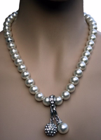 German Wear Traditional Women’s Costume Necklace German Wear Traditional Women’s Costume Necklace featuring white mother-of-pearl and imitation pearls with detachable charms, perfect for Oktoberfest accessories or German jewelry buy online now