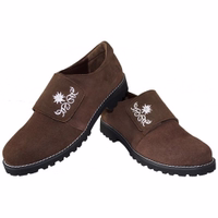 A pair of dark brown traditional Bavarian women's shoes, featuring classic lederhosen styling. These trachten shoes reflect authentic Bavarian design, showcasing the heritage of traditional footwear.