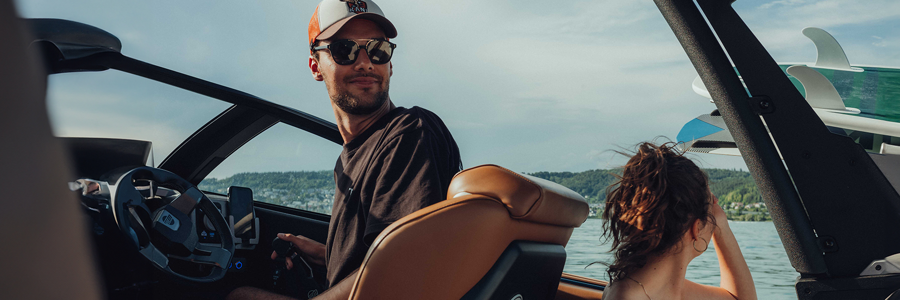 Janik Mesle at the helm of the boat during product shoots on Lake Constance